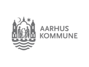 Aarhus Kommune logo, with grey text and a shield, with a portal, flanked by two towers and a spire, reproduced by St. Clemens and St. Paul. Above the portal is a moon and a seven-pointed star, and below it one ove